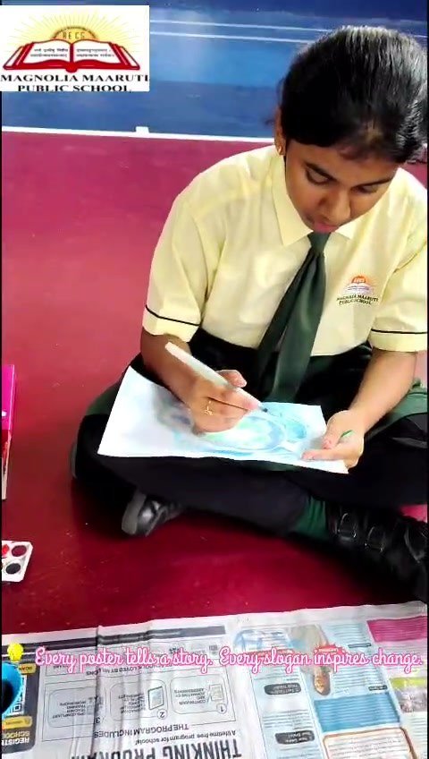 Student creating environment awareness poster