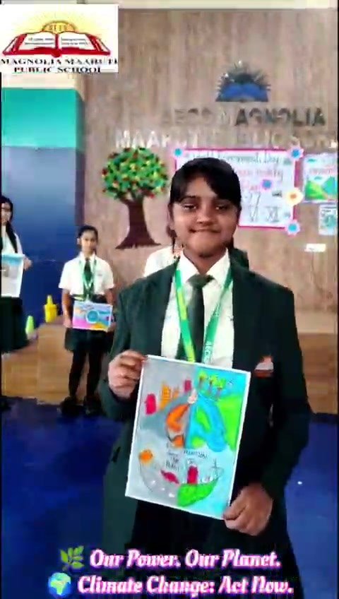 Student displaying environment awareness poster