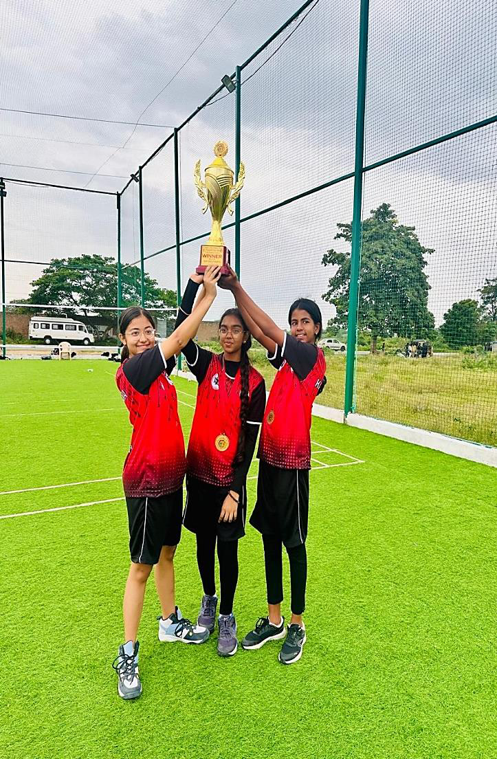 AECS Magnolia Maaruti girls' team lifting the winners' trophy at the Flying Tennis National Championship 2026, Kothur